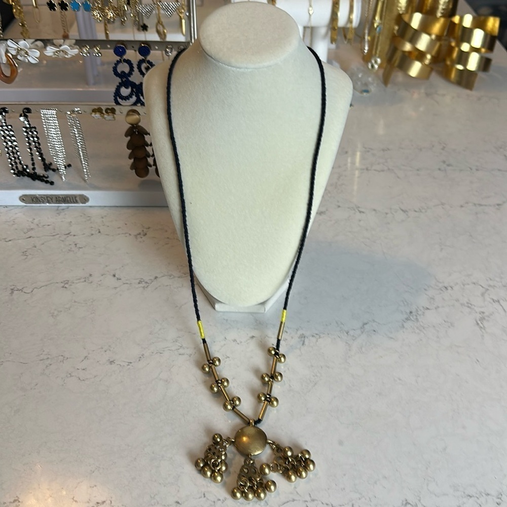 J Crew long black cord gold tone charm costume necklace​